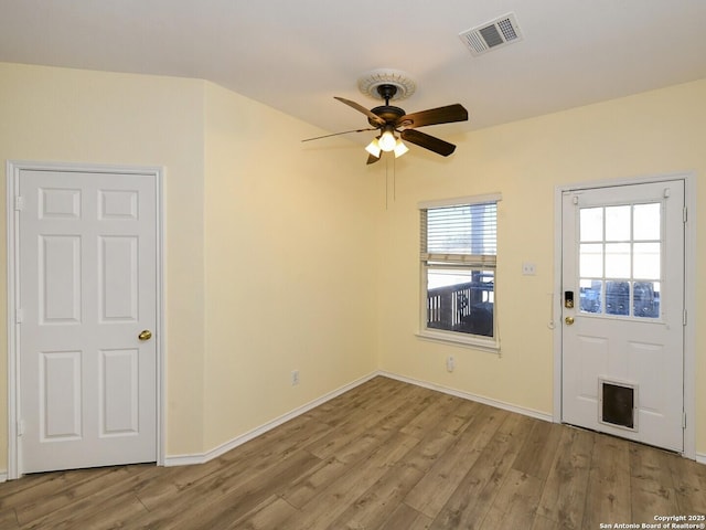 spare room featuring light wood-type flooring and ceiling fan