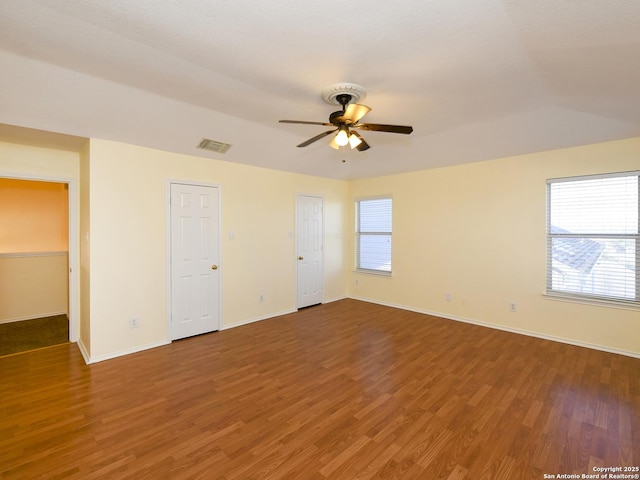 spare room featuring hardwood / wood-style floors and ceiling fan