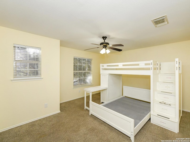 unfurnished bedroom featuring ceiling fan and carpet floors