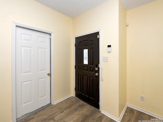 foyer entrance with dark hardwood / wood-style flooring