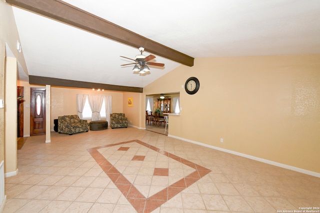 unfurnished living room with ceiling fan with notable chandelier, light tile patterned floors, and vaulted ceiling with beams