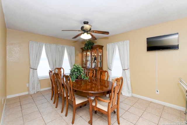 dining room with ceiling fan and light tile patterned floors