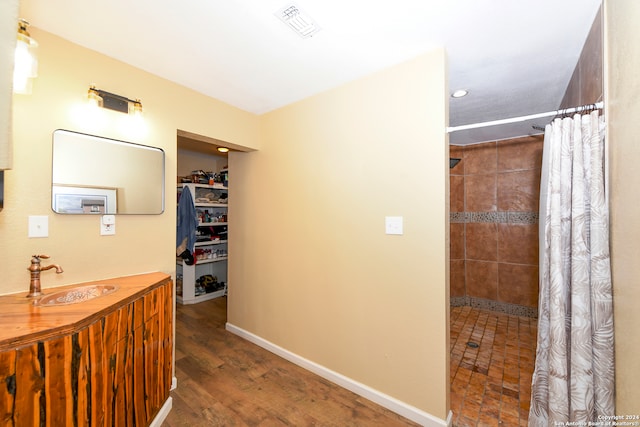 hallway with dark hardwood / wood-style floors and sink