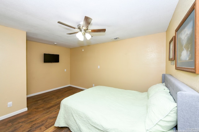 bedroom with dark wood-type flooring and ceiling fan