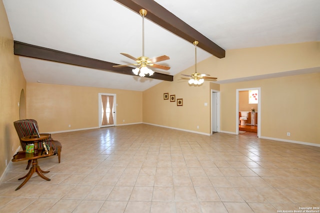 spare room with vaulted ceiling with beams, ceiling fan, and light tile patterned floors