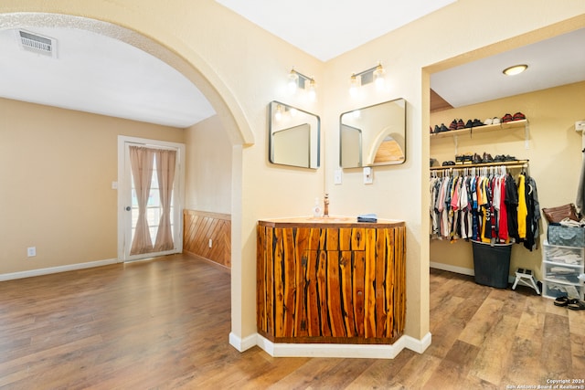 bathroom with vanity and hardwood / wood-style flooring