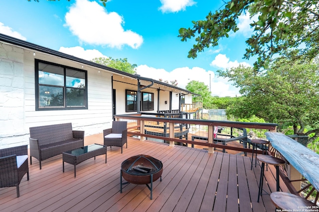 355 Mountain Creek Rd, Pipe Creek, TX 78063 - wooden deck featuring an outdoor living space with a fire pit