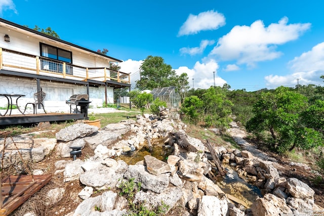 355 Mountain Creek Rd, Pipe Creek, TX 78063 - view of yard featuring an exterior structure, a balcony, and an outbuilding