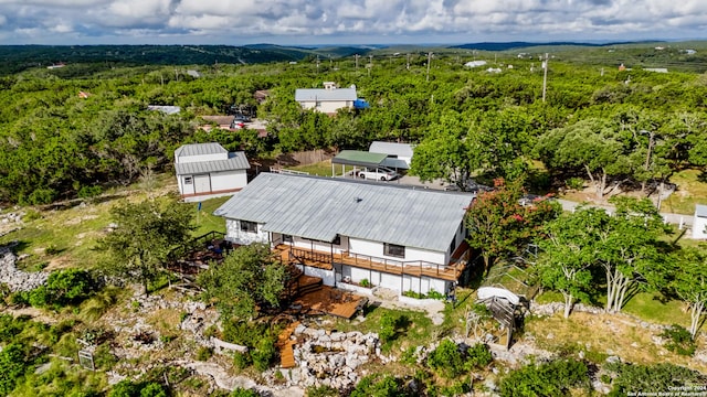 355 Mountain Creek Rd, Pipe Creek, TX 78063 - aerial view of property and surrounding area with a heavily wooded area