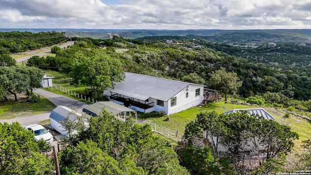 355 Mountain Creek Rd, Pipe Creek, TX 78063 - aerial view of property and surrounding area with a heavily wooded area