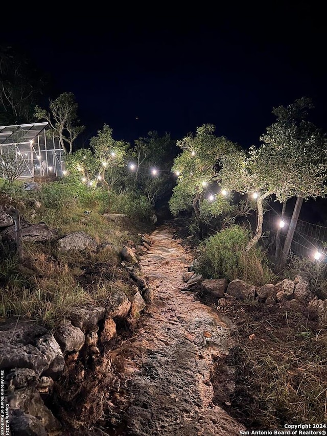 355 Mountain Creek Rd, Pipe Creek, TX 78063 - view of yard at night