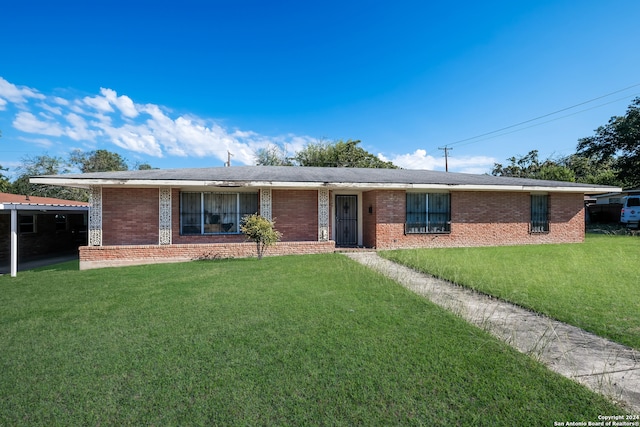 single story home featuring a front lawn