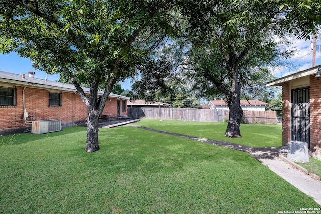 view of yard with central AC unit