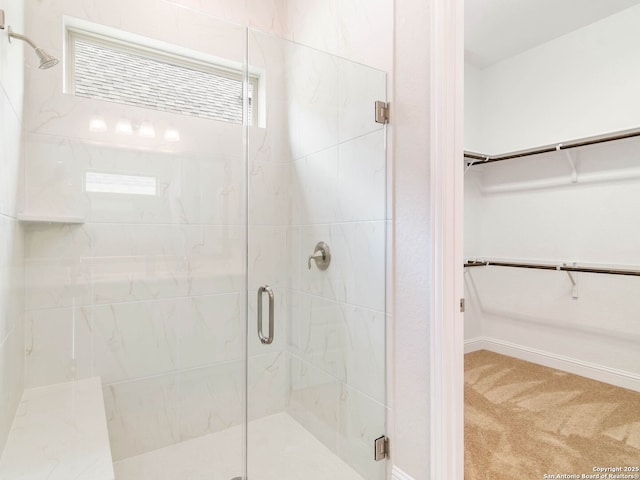 unfurnished room featuring concrete floors, lofted ceiling with beams, and baseboards