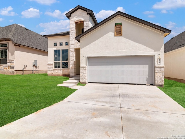 view of front of home featuring a front lawn and a garage