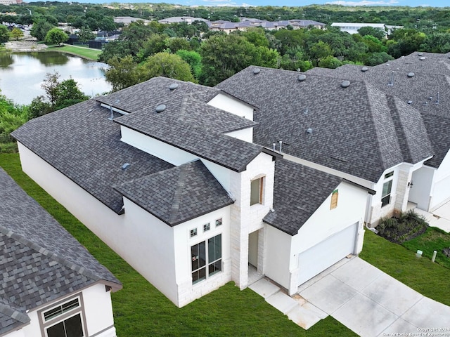 birds eye view of property with a water view