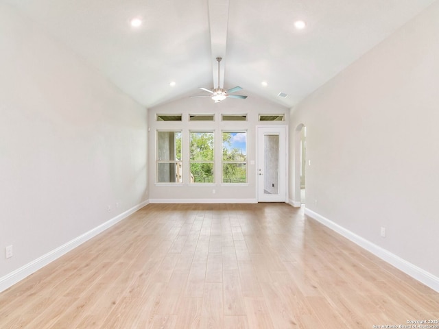 kitchen with baseboards, white cabinets, light wood-style flooring, and a kitchen island