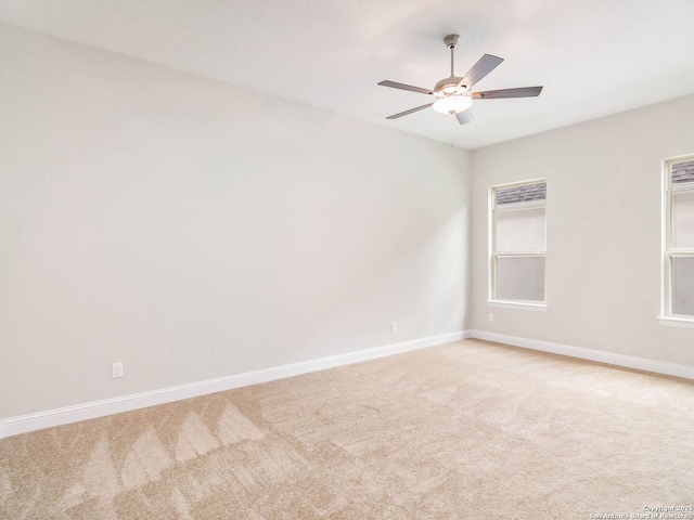 unfurnished room featuring baseboards, lofted ceiling with beams, light wood-style flooring, and a textured ceiling
