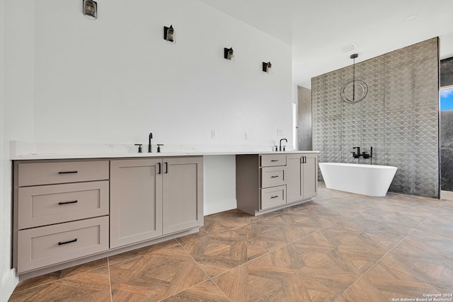 bathroom with parquet flooring, independent shower and bath, and vanity