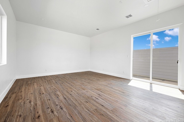 spare room featuring hardwood / wood-style floors