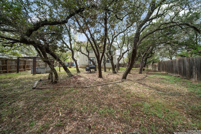 view of yard with a fenced backyard