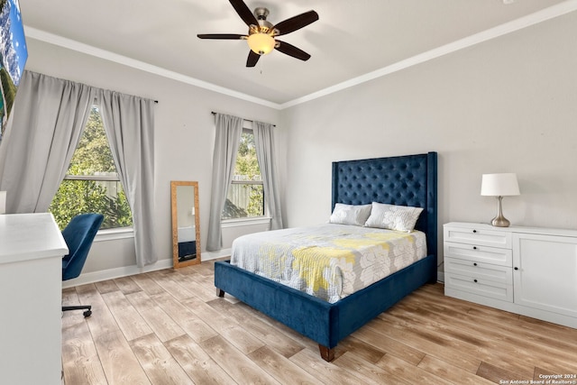 bedroom with multiple windows, ceiling fan, and light hardwood / wood-style flooring