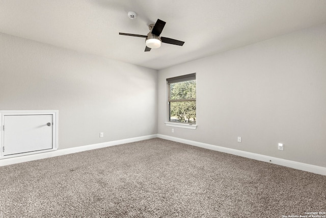 carpeted empty room with ceiling fan