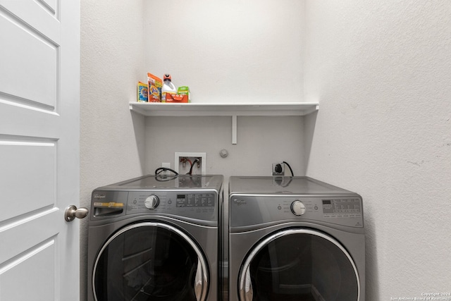 laundry area with independent washer and dryer