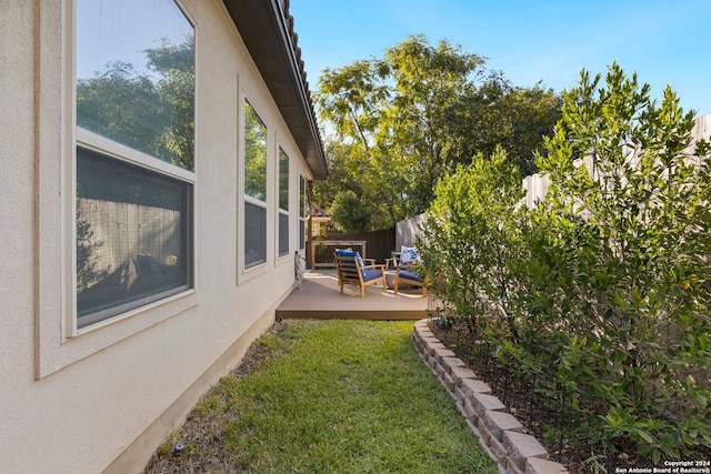 view of yard featuring a wooden deck