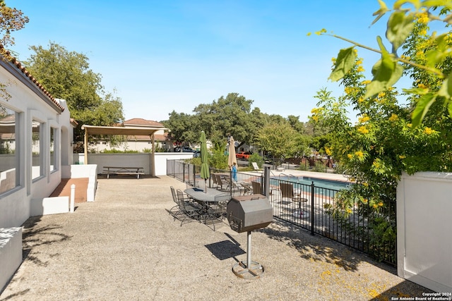 view of patio / terrace featuring a fenced in pool