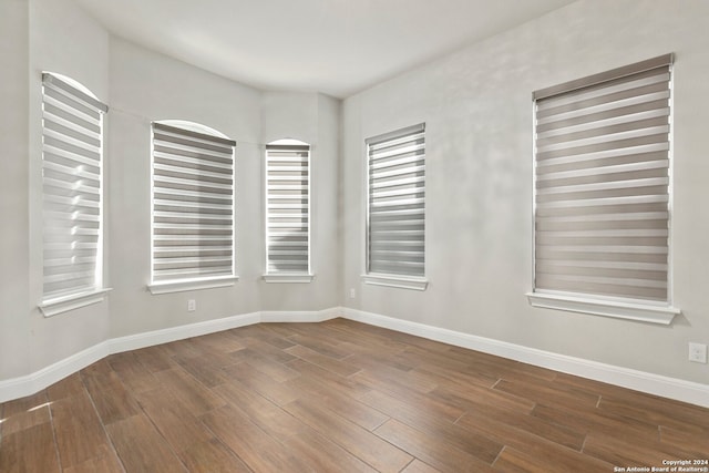 spare room featuring dark hardwood / wood-style flooring