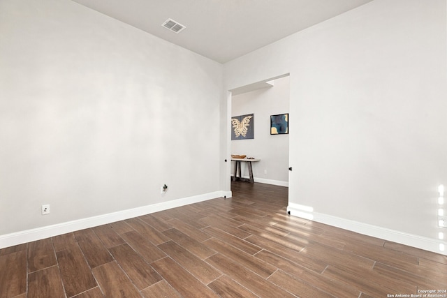 empty room featuring dark wood-type flooring