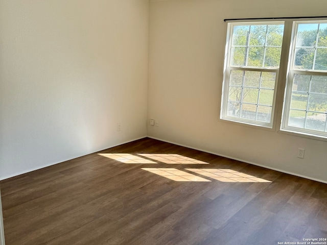 spare room featuring dark hardwood / wood-style floors