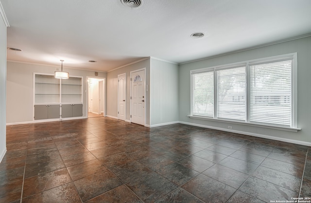 unfurnished living room featuring built in shelves and crown molding