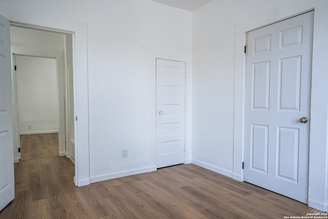 unfurnished bedroom featuring hardwood / wood-style floors