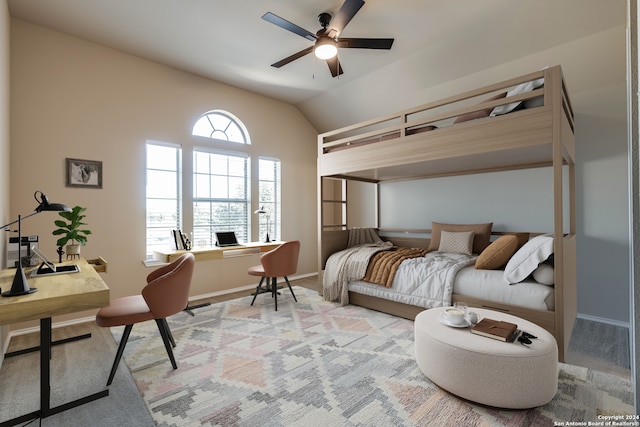 bedroom with ceiling fan, light carpet, and vaulted ceiling