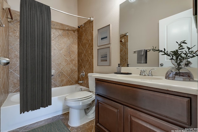 full bathroom featuring tile patterned flooring, vanity, toilet, and shower / bath combo with shower curtain