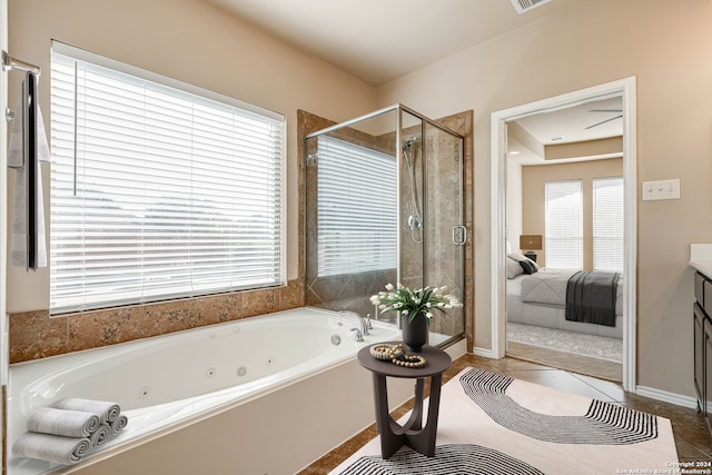 bathroom featuring tile patterned floors, vanity, and plus walk in shower