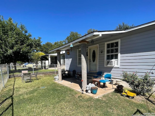 view of property exterior with a patio and a yard