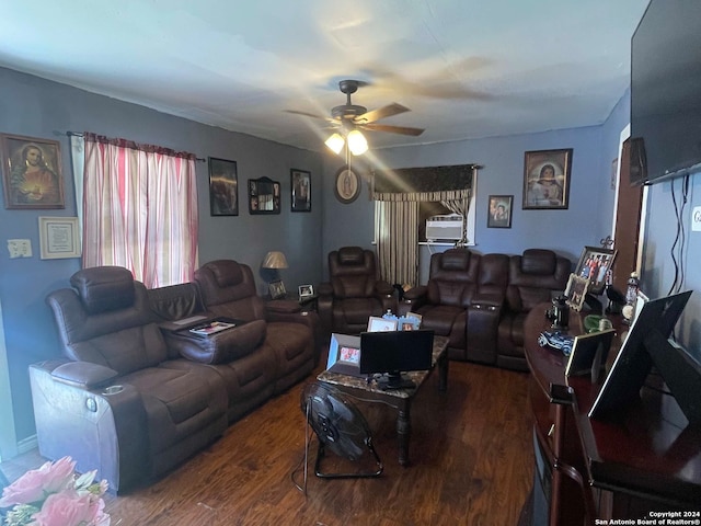 living room with dark hardwood / wood-style flooring and ceiling fan