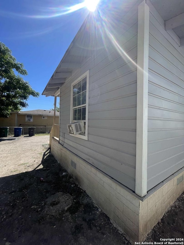 view of home's exterior with cooling unit and crawl space