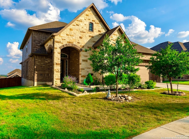 view of front facade featuring a front lawn and a garage