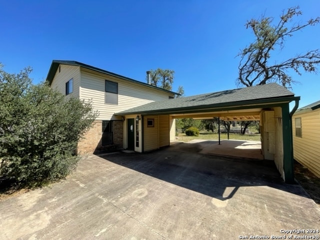 view of front of home featuring a carport