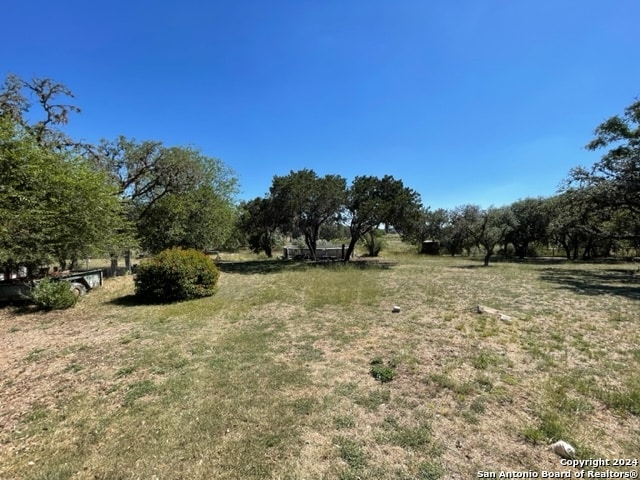 view of yard with a rural view