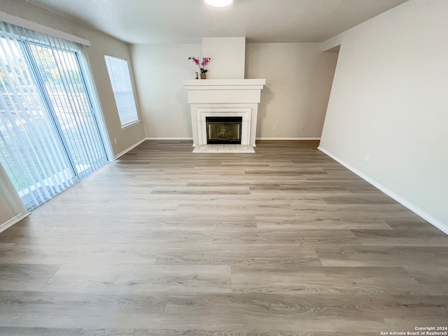 unfurnished living room with light hardwood / wood-style flooring