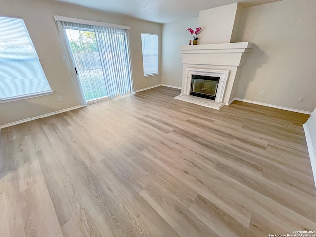 unfurnished living room featuring light hardwood / wood-style flooring