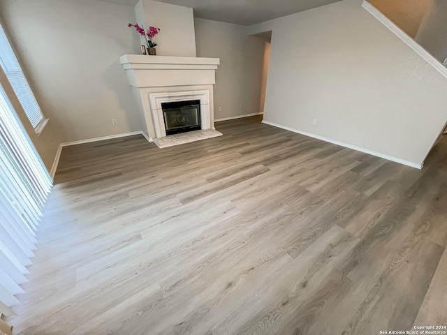 unfurnished living room with light hardwood / wood-style floors