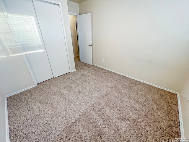 unfurnished bedroom featuring carpet flooring