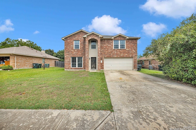 view of front of house featuring a front yard and a garage