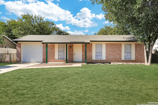 single story home with a front yard and a garage